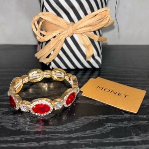 Women’s stretch red rhinestone bracelet by Monet. Brand new with tags.
